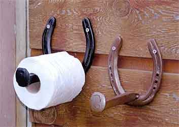 railroad spike as wall hook for tissues